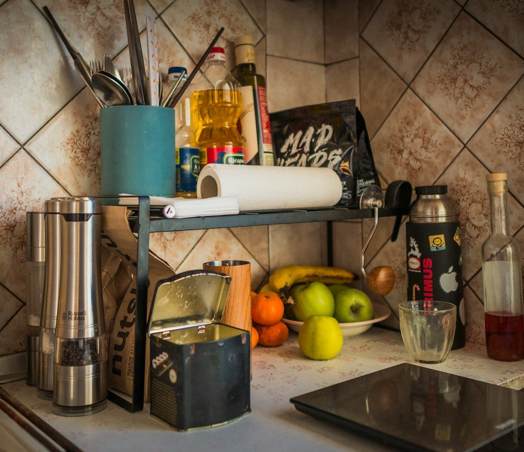 Kitchen counter with fruit, spices, and utensils